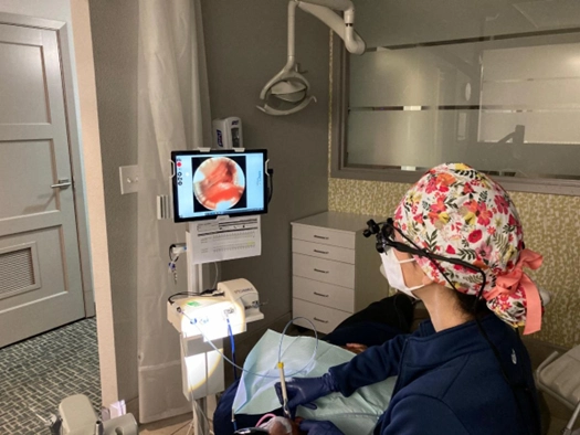 Council Oak Perio hygienist performing visual scaling and root planing with dental endoscope in Austin TX