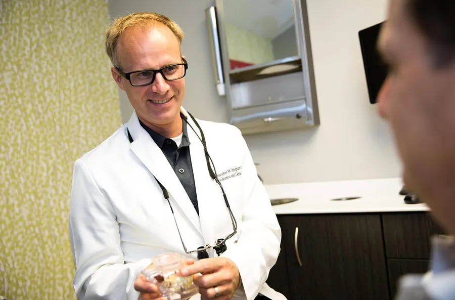Dr. Christopher Bingham, board certified periodontist, explaining whether gum disease can be cured at Council Oak Perio, Central Texas periodontics in Austin